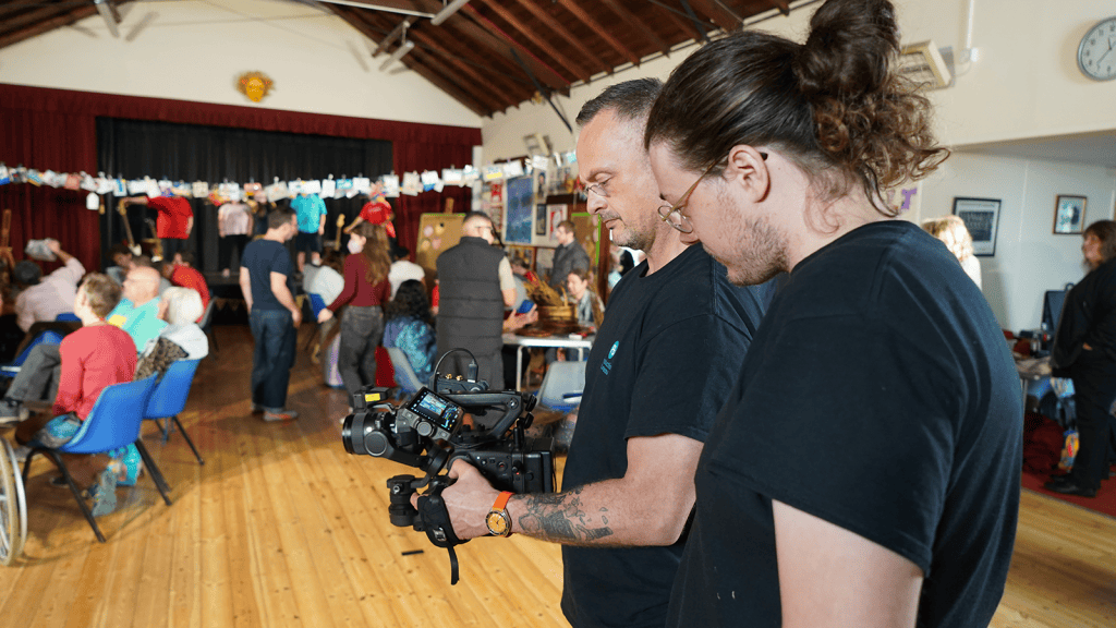 production bureaus camera team reviewing footage of the suffolk artlink workshop